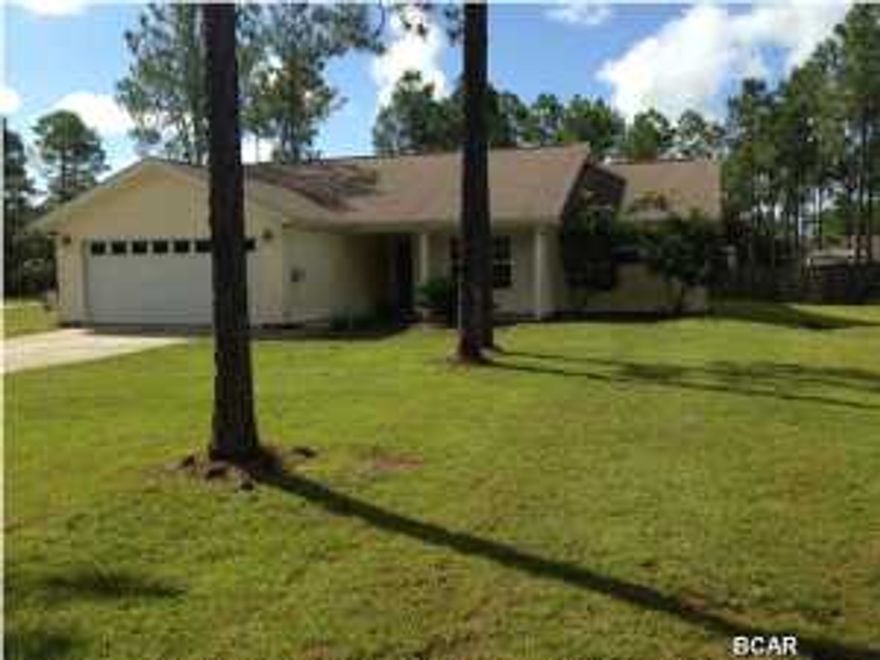 This is Country Living at its Best! This spacious home features 3 bedrooms and 2 baths on 1 Acre and was built in 2006. As you enter the foyer, you will be treated to an open floor plan, allowing for easy conversation. The home offers beautiful laminate wood flooring throughout the main living area flowing into the dining room and kitchen, carpet in the bedrooms and title flooring in both bathrooms. You will enjoy cooking in the clean open kitchen that features white appliances graced with white cabinetry giving a stunning appearance. The home also features split bedrooms for the convenience of parents and children. The double garage is spacious and the drive-way has plenty of room for additional parking; and there is an attic access with pull-down stairs. The rear yard is privacy