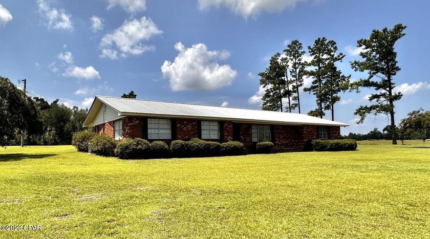 CURRENTLY UNDER CONTRACT, SELLER WILL CONSIDER BACKUP OFFERS.  Beautiful brick home located on a paved road with almost 3 acres. Three bedrooms, two full baths, and attached two car garage with a half bath in laundry area. New HVAC system to include duct-work.  Fairly new metal roof.  Home has been freshly painted and all new floor covering. Home features two large family/living areas and a BIG covered and enclosed back porch/sunroom for entertaining. Property also has a large storage shed and a detached RV carport. Seller has a current survey.  Make an appointment to see this one before its gone!