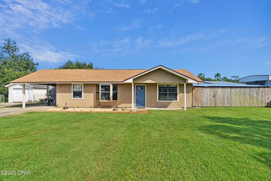 Quick closing available! Welcome to a slice of paradise with absolutely NO HOA restrictions and the exciting possibility of SHORT-TERM RENTALS! This enchanting 2-bedroom, 2 full bathroom haven is nestled on over one-fourth of an acre, providing ample space for your gatherings in a charming, fenced backyard that's your very own private retreat and entertainers dream.
Step inside, and you'll discover a home that's been lovingly revamped to its very bones by the current owners, who embarked on a full-scale renovation journey starting in 2008. This place boasts character and modern amenities galore!
In the heart of the home, the kitchen welcomes you with granite countertops and a suite of electric appliances. And the beautiful laminate flooring gracefully guides you through the cozy space.
Venturing into the backyard, you'll be captivated by the possibilities. A substantial 20-inch concrete slab, fully permitted, eagerly awaits your creative vision—a potential for a two-story expansion, turning your dreams into reality.
Your outdoor escapades continue with a covered space that's tailor-made for savoring al fresco meals. With built-in counters, refrigerator, microwave, and oven, it's the ultimate outdoor dining experience. The sprawling concrete patio is a canvas for your outdoor furniture, ready to host multiple tables and chairs. Plus, there's a delightful private outdoor shower with hot water—a luxurious touch for your beachside retreat!
But wait, there's more! The backyard also houses a 12x24 shed adorned with built-in shelving, and a convenient covered lean-to, perfect for stowing away your yard tools and trusty lawnmower. Also, an efficient well irrigation system ensures that your grass stays picture-perfect year-round.
And the icing on the cake? This splendid haven is just a breezy 5-minute jaunt away from restaurants, the marina, and the most beautiful beaches. 
In this remarkable abode, the possibilities are endless, and the cozy charm is abundant. Make it your haven, and let the good times roll! Sellers will pay closing costs (title, doc stamps, owners title, and agent commissions).