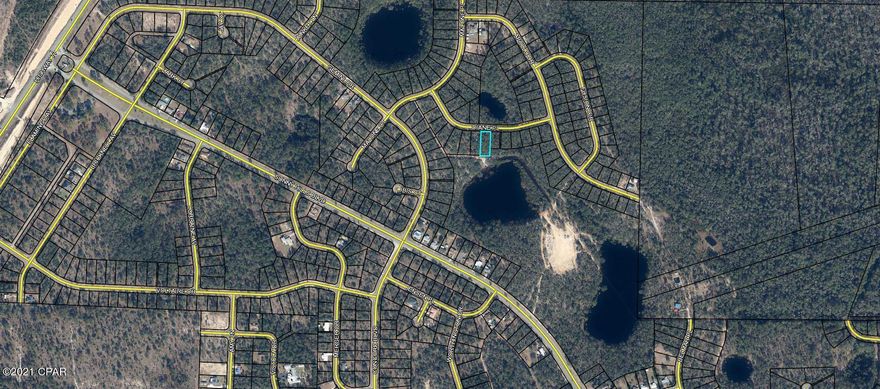 FUTURE HOME SITE CLOSE TO HWY 77 & THE MAIN ENTRANCE OF SUNNY HILLS!!! This beautiful lot backs up to a fire trail and two ponds on a large county owned parcel. Also, there is a pond located across the road. If you love to swim, fish or play golf, you're going to love it here. This community has a beautiful lake with a public swimming beach known as the popular Boat Lake. There is a really nice 18 hole public golf course and many fishing lakes Boat Lake with a safe swimming beach, and several fishing and recreational lakes in the area. Sunny Hills is located only 25 miles north of Panama City and 18 miles south of Chipley. Buyer is to pay owner's title policy, doc stamps on deed and closing fee.  Additional lots throughout Sunny Hills are also available!!!