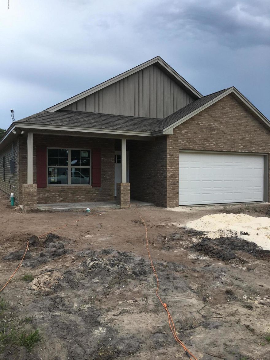 This new construction home awaits a buyer that wants to make it their home.  This craftsman style three bedroom, two bath home features nine foot ceiling throughout with step ups in this great room and master bedroom.  The kitchen is equipped with custom cabinets and stainless steel appliance.  You will need to schedule a tour to check out the upgraded light fixtures and other features this house has to offer.  Don't delay as this house will not last long.  Call your realtor today.  Once rain is complete the driveway, sprinkler system and landscaping will be installed.