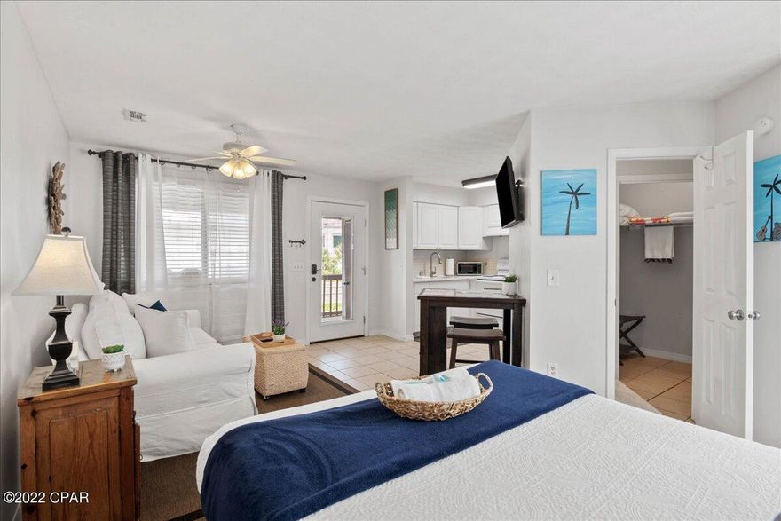 'CURRENTLY UNDER CONTRACT, SELLER ACCEPTING BACKUP OFFERS' Sand Castle Villas Unit #17 is an absolutely gorgeous, fully renovated luxury studio located just steps from the beach!  This pristine, turn-key investment property has a history of a very high documented short-term rental income; but can also be purchased as a long term rental investment unit or as an owner occupied property.  Fully furnished and fully stocked- features include ceramic tile flooring, granite countertops, stainless steel appliances, a washer and dryer in the laundry room, a pull out couch, and a gel memory foam mattress on the bed-so it sleeps a total of 4.  The property includes a private enclosed pool for your enjoyment and beach access #13 is just steps away.