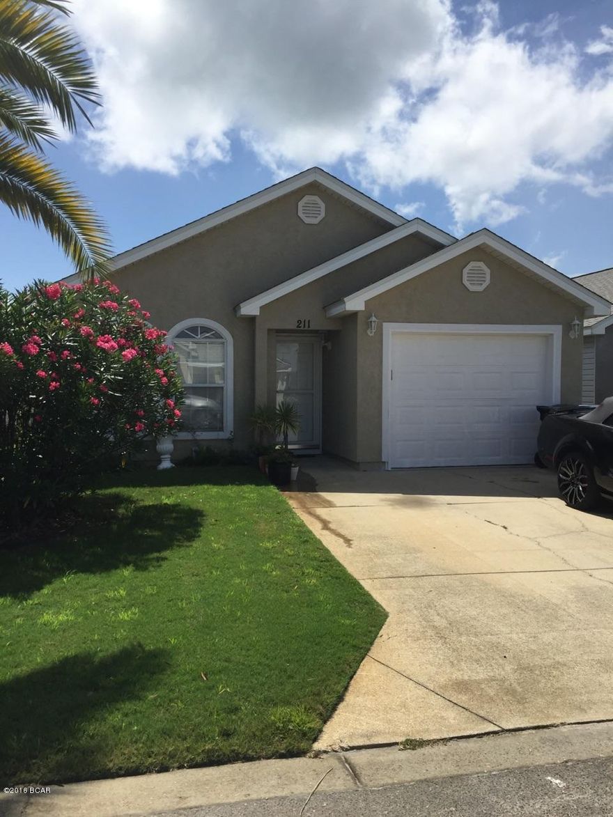 Very well kept home is a desirable neighborhood, close to shopping and many restaurants.  2 miles to Pier Park.  Home has all tile, new sliding doors with mini blinds inside, and includes a small fenced in back patio.  All appliances are included.  Home is priced to sell.