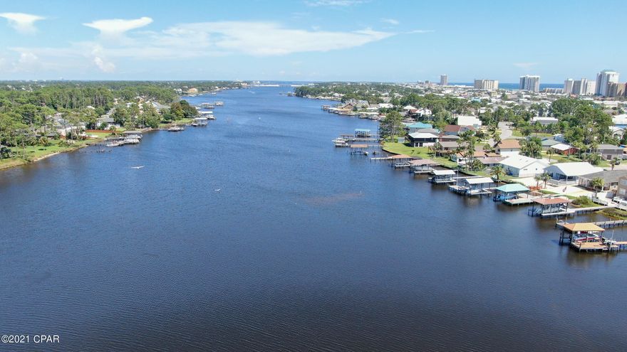 Taking Backups the phrase 'CURRENTLY UNDER CONTRACT, SELLER ACCEPTING BACKUP OFFERS' WATERFRONT home on the Grand Lagoon with easy access to the Gulf of Mexico, the beautiful beaches, shopping, dining and entertainment. Three bedrooms, 2 baths, and a 2 car garage.  Easy walk or golf cart to the beach or take your boat/jet ski to Shell Island or go fishing in the Gulf.