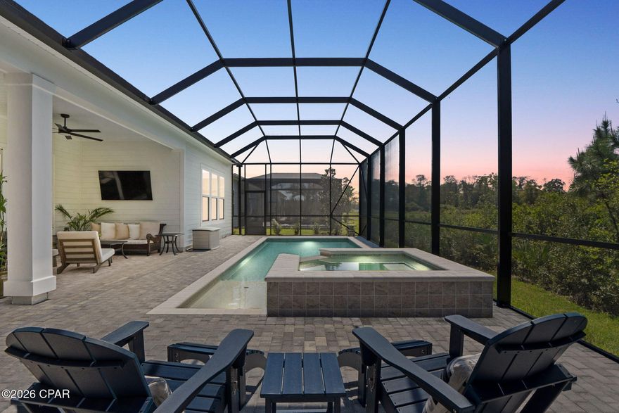 Welcome to a home that was never meant to be sold.

Built in August 2025 as a true forever home, every detail of this custom Toll Brothers Caswell design from the Vista Collection was thoughtfully selected with intention, quality, and comfort in mind. Life simply had other plans--offering a rare opportunity to own a nearly new, highly upgraded home without the wait.

Tucked away on a premium cul-de-sac lot, with the majority of construction on the street already complete, this home offers a sense of peace, privacy, and permanence that's hard to find in newer communities. Backing to a natural wooded area with serene lake views beyond, you'll enjoy no rear neighbors and a setting that feels both private and connected to nature.

Step outside and you'll immediately understand the lifestyle this home was designed for. The backyard has already been transformed into a private retreat, featuring an 11' x 24' saltwater, heated pool with a steel-reinforced shotcrete shell, pebble sheen finish, tanning shelf, and bench seating. The attached spa with waterfall and five jets creates the perfect place to unwind, all enclosed within a spacious screened enclosure--so you can enjoy it year-round without the hassle, expense, or wait of building it yourself. The home is also pre-plumbed for gas on the lanai, offering the option to easily add a future outdoor kitchen.

Inside, the attention to detail is evident in every space. A bright, open layout is enhanced by a multi-slide stacked glass door that seamlessly connects indoor and outdoor living, while tray ceilings in the foyer, great room, and primary suite add architectural interest and dimension. The office is enclosed with glass doors, creating a functional yet stylish work-from-home space.

The kitchen was designed to be both beautiful and highly functional, featuring an oversized double-sided island with abundant storage, quartz countertops, custom cabinetry, a ceramic tile backsplash, and a suite of stainless KitchenAid appliances including a 36'' gas cooktop with hood, built-in microwave, and oven, complemented by a Samsung Bespoke refrigerator.

The primary suite offers a true retreat with a spa-like bathroom featuring a frameless glass shower with ceiling-mounted rain head, upgraded Kohler fixtures, elevated vanities, and designer tile selections carried throughout all bathrooms. Hard surface flooring runs throughout the home, with porcelain tile in all baths and thoughtfully selected finishes that elevate each space.

Additional upgrades include hurricane-rated front and rear windows and doors, solid 2x6 construction, LED recessed lighting with dimmers, smart home technology, a security system, upgraded interior hardware, comfort-height toilets, and a spacious three-car garage with durable, non-slip polyurea/polyaspartic flooring. The paver driveway and updated landscaping with palm trees complete the home's polished coastal curb appeal.

Located in a thoughtfully designed community where each home is individually built--never mass-produced--you'll also enjoy resort-style amenities including a pool with lap lanes, fitness center, luxury clubhouse, pickleball and tennis courts, and a playground. All of this just 4 short miles from the beach, shopping, dining, entertainment, and 10 miles to the Northwest Florida Beaches International Airport.

If you've been searching for a home that offers the quality of new construction, the upgrades of a custom build, and the ease of being completely move-in ready--this is an opportunity not to be missed.