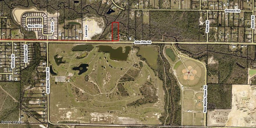Check out this wonderful building lot, Seller will divide the parcel as an option into 2 parcels, each would be 100 x 469. Located in a country setting yet very close to town, lot backs up to Bayou George Creek, front is a paved road with access to County water and sewer.  Across the street from Bay Dunes Golf Club and the H G Harders Recreational Complex is super close as well for all the wonderful sport activities enjoyment! Only a few miles from Deer Point Lake, Tyndall AFB, Beautiful Beaches of PCB!  So Much Potential, just needs you to plan your Dream homestead!  Thank you for considering this lot.  Call your favorite Realtor and go see! All measurements and information should be verified by buyer or buyer's agent if important.
