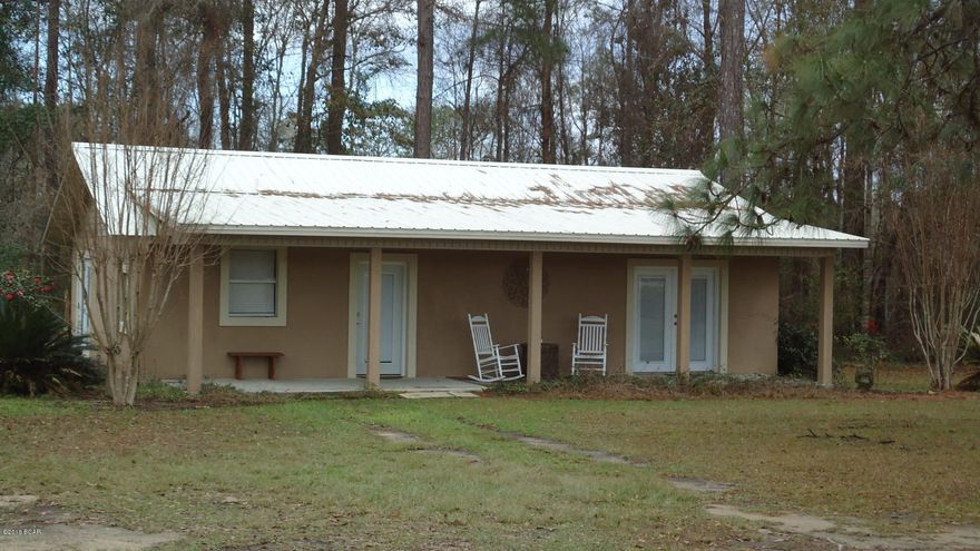 Looking FOR A GREAT PLACE IN THE COUNTRY THIS IS IT. 2 BEDROOM 2 BATH HOME SITTING ON 2 ACRES.HOME IS MOVE IN READY.FRONT OF PROPERTY IS FENCED WITH GATE FOR PRIVACY.PROPERTY HAS FREE STANDING CARPORT AND NICE SHED/ WORKSHOP.HOME HAS METAL ROOF.MAKE AN APPOINTMENT TO SEE THIS HOME SOON!!!