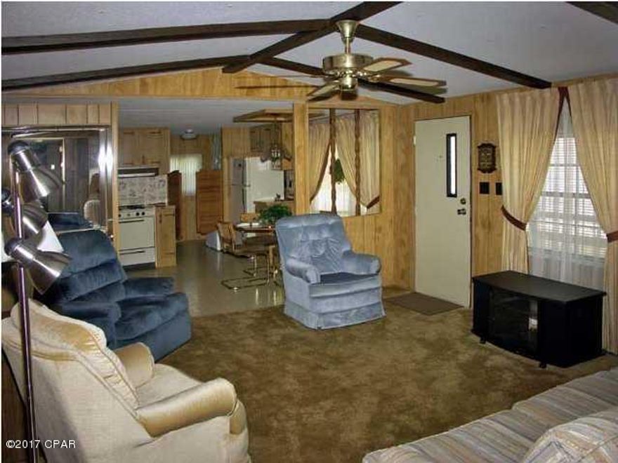 Mobile home on lot walkable to the beach.