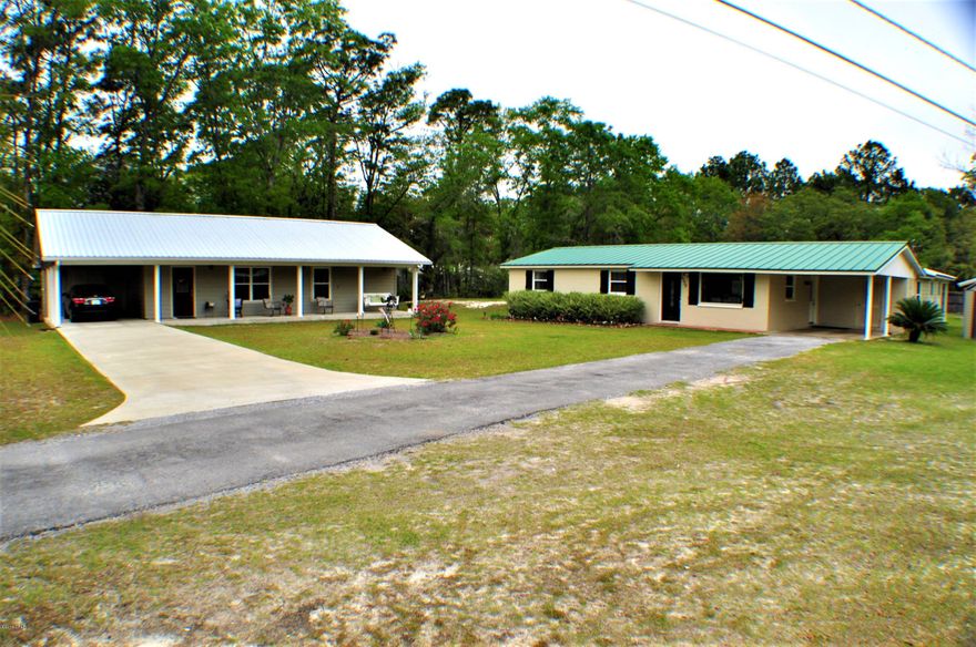 TWO immaculately kept homes on 1.2 acres with a 28X44 detached workshop. Main house was built in 1968 and was completely  remodeled in 2014 with upgrades including a custom kitchen with platinum quartz countertops and solid wood cabinetry,new HVAC unit in 2017 and is a 4BR/3BA with 2 master bedrooms. The 2nd home is a Mother-in-Law/Guest house and features granite countertops, wood tile flooring throughout and is completely handicapped accessible with large doorways and a zero entry oversized shower. This home is 1BR/1BA  with large laundry room, a huge walk-in closet and a southern style front porch. The detached shop has a loft area for storage, a covered open porch area and a separate insulated climate controlled room. Property is close to schools, Tommy Smith Elementary and Merritt Brown Middle School and is zoned for Mosley High School. 

Main home is approx. 1900sqft with 4BR/2.5BA and second home is 960sqft with 1BR/1BA.  Property is being sold as one. Main house built in 1968 with complete remodel in last couple of years.  MIL/guest home built in 2014.  All info is approx. and must be verified by Buyers if important.