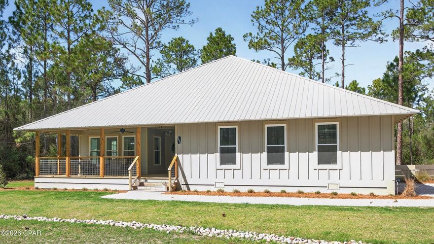 Welcome to 6608 Button Buck Trail, nestled within the highly sought-after RiverCamps community in Panama City Beach. Where nature, privacy, and coastal living come together effortlessly.

Surrounded by preserved woodlands and peaceful scenery, RiverCamps offers a lifestyle unlike anywhere else. Enjoy access to a community pool, scenic boardwalks, boat storage, and a private boat launch, perfect for days spent exploring the water or unwinding in nature. This quiet, tucked-away neighborhood is ideal for those craving both adventure and tranquility.

Built in 2025, this beautifully crafted home offers 2,238 heated and cooled square feet with a thoughtfully designed open floor plan that feels both spacious and inviting. Every detail has been carefully constructed, showcasing quality finishes, stunning architecture, and timeless design throughout.

The home features 3 bedrooms and 2.5 bathrooms, along with granite countertops, a gorgeous kitchen, and all appliances included, making it truly move-in ready. A home generator adds an extra level of comfort and security, a rare and valuable feature.

Step outside to a fenced-in backyard, perfect for pets, entertaining, or simply enjoying the peaceful surroundings. The spacious two-car garage provides ample storage for all your coastal lifestyle needs.

If you've been looking for a home that blends modern comfort with the beauty of nature, this is your opportunity to experience the best of RiverCamps living.