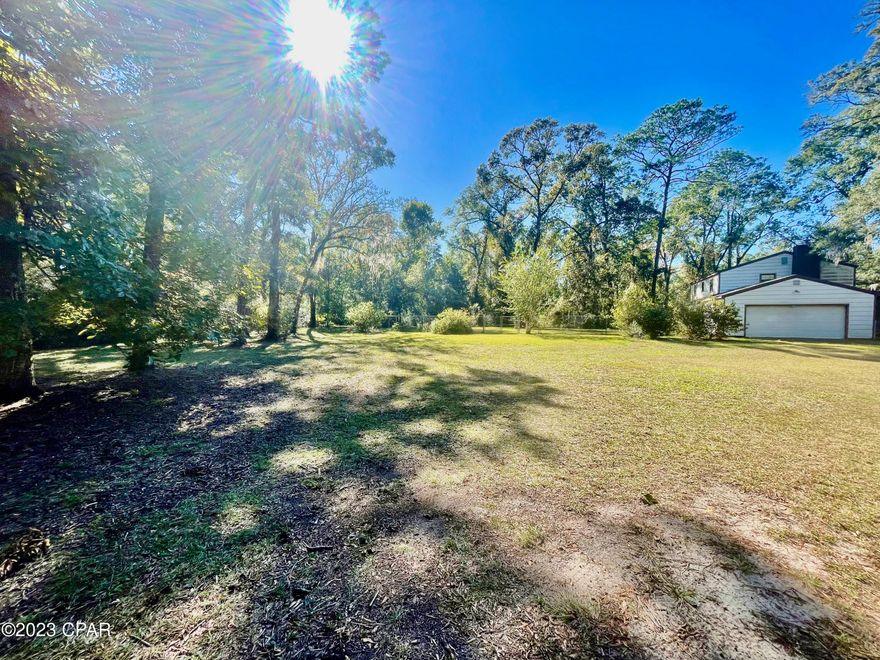 Location Location Location!! one minute walk to the Wakulla County School, with 4 bedroom, and 2 and half bath, 2 car garage, big screened porch, fenced yard and carport for storage. this house just needs TLC, and it will make a beautiful home, with 2 Acre, plenty of land and privacy.