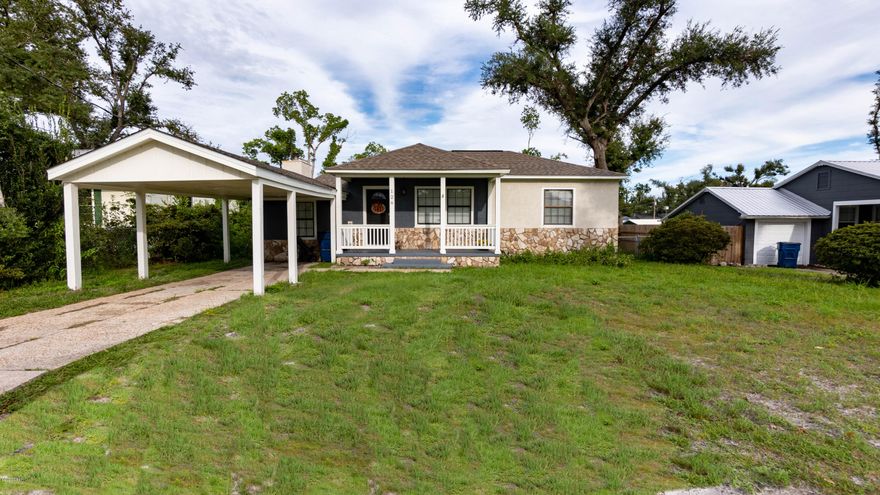 ATTRACTIVE HOME IN THE COVE! The interior of this home features 2 bedrooms, 1 full bath, 2 living rooms, Vinyl Plank Floors throughout, a wood burning fireplace, an interior laundry room and ample natural light. The kitchen has new cabinets, granite counter tops, white appliances and a pantry. The exterior features a covered front porch, a 1 car carport, an open back deck (great for entertaining), a storage shed, and a fenced backyard with double gate alley access (Park your Boat). NEW: Roof, HVAC, Tankless Hot Water Heater, Flooring, Paint, etc. X Flood Zone. No HOA. Call today for a private preview. Information derived from seller and public record; buyer to verify. Measurements approximate.