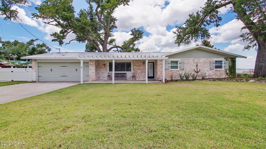 CURRENTLY UNDER CONTRACT, SELLER ACCEPTING BACKUP OFFERS Hello AMAZING!!! If you're looking for waterfront, look no further! This house is absolute perfection! From the open floor plan to the suede finished countertops, to the high-end appliances, to the copper soaking tub - - you will not see another house this spectacular!  

Please note - - The main house is 1852 sq ft, 3 bedroom/2 bath, guest house is 504 sq ft, 1 bedroom, 1 bath.  

You will feel at home the moment you walk into the open great room and gaze out the floor to ceiling windows at the other end of the room out to the expansive yard leading to the open Bay - The living area is graced with a gas fireplace with German Schmear brick surround and eye-catching mantle.  The chef's kitchen has suede granite countertops, a down dra Thermador double oven, tons of custom cabinets, farm sink, stainless appliances - it's magnificent. The dining area is large enough for your whole family - and there's a large breakfast bar for more intimate gatherings.  Lovely lighting package.  The den has floor to ceiling windows, ship lap walls, pickled wood plank ceiling and open beams.  This home is perfect for entertaining with it's open space and character.  All the bedrooms have built in's - closets and drawers and are just charming.  The owner's suite has a walk in closet and a secondary "step in closet", the bathroom features a large tile shower, copper soaking tub, oversized double vanity, and a sliding barn door.  There's a large laundry room off the kitchen. Really no detail has been overlooked.  And there's more!!! If you need additional space, there's a guest house out back with a mini-split for controlled temperature, whether you're working from home or utilizing the space for guests, you'll find a kitchenette, full bathroom (with shower), walk in closet and 2 lofts that could easily be loft beds.  Large yard is almost an acre! Seawall, boat launch/ramp, and the views of East Bay are just breathtaking! Make your appointment to see this lovely home today! (all sizes approximate and taken from public records, buyer to verify any details buyer deems important).