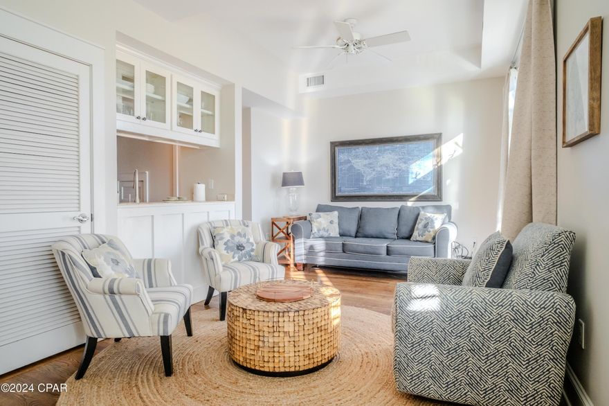 Superbly located to the exquisite amenities and activities of 30A and Pier Park. Just a 5 minute walk to the beach, this stunning and updated 1 BR and 1 1/2 BA condominium is within the envious community of Carillon Beach Resort. Furnished in a light and airy decor with a living and dining room combo floor plan, an open kitchen, a half bath, in unit laundry, and a spacious balcony on the first floor overlooking the Town Center with views of the lake. On the second floor are the large bedroom with a sitting area and a bath with a skylight. Lake Carillon and Gulf views can be seen from the second floor. Appointed with new stainless steel appliances, new Kohler sink and faucet, new planation shutters, refinished hardwood floors downstairs, new LVP floors upstairs, and tile in the baths. Carillon Resort offers an abundance of amenities including 3900 feet of beach frontage with 7 beach accesses, 3 pools including a Gulf front pool, coffee shops, wine bar, restaurants, yoga and health spa, salon, basketball, playground, pickle ball, local artist shops, bike and water spot rentals, fishing, and tennis. Rosemary Beach and the beaches of 30A are within a 5 minute drive west, and the bustling entertainment of Pier Park is about 10 minutes to the east. Come see this condo and enjoy the beach lifestyle!