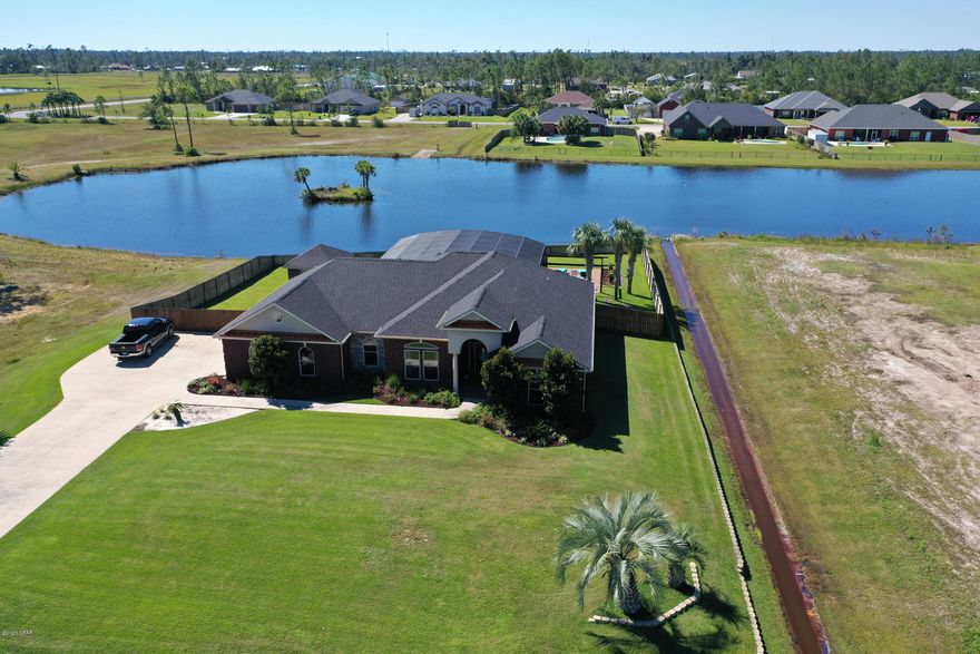 Very Nice home in the community of Kirkland's Manor- 4BRs, 3 Baths, majority of this house has been updated and is new! Kitchen has all new appliances, custom cabinets, Luxury Vinyl Flooring, 2423 sq ft, on just under an acre lot! New floors throughout, Master Bathroom has been remodeled.  This home has indoor and outdoor speaker system, large screen enclosed pool(heated) with covered grilling area.  Please note - spray foam insulation, oversized driveways / ample parking for toys / RV, 12x18 storage building w/ electric/ built in shelves /6x8 roll up door.   AC is newer and comes with a 10 year transferrable warranty, new pool equipment, new garage door/opener with warranty.  As you can see this home is a must see and almost all new inside and out! You will also have a great view of one of the two lakes in Kirkland's Manor, you can water ski, jet ski, wave runner ride, paddle board, canoe and the fishing is amazing as well.  This community  is very well upkept, in a great area that is only minutes to shopping, hospitals and about 35 minutes to Panama City Beach.  Call today for additional details or to schedule a showing.