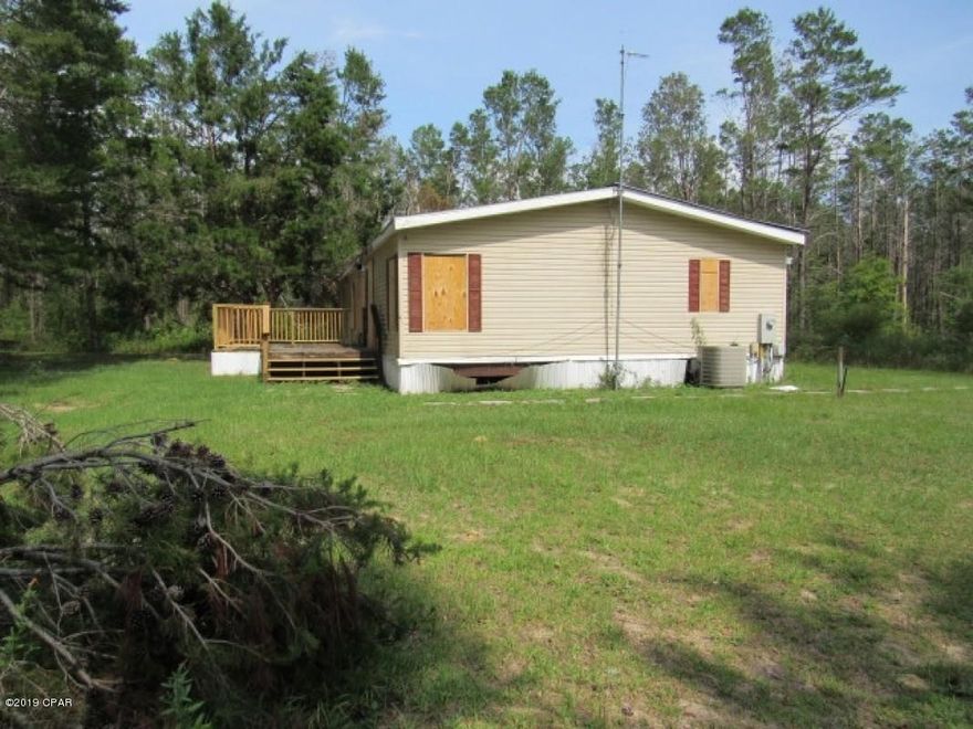 3 bed, 2 bath manufactured home in Panama City, FL. Sitting on 3.01 acres of property in need of major repairs due to past hurricane damage. This would make a great location to fixer it up or build your dream home.