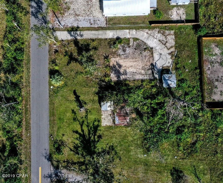 1318 Center Ave, vacant lot, driveway still in tact, buildable, flood zone X, 68x144, come visit today!