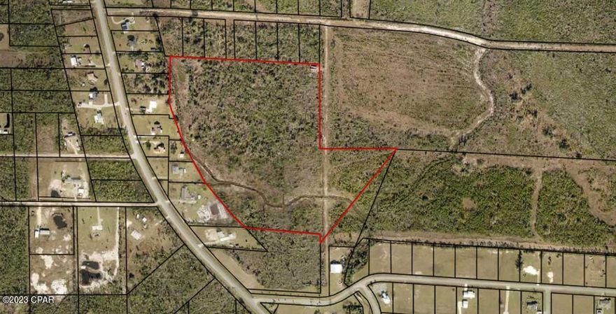 This is a phenomenal acreage for this area. This parcel is 90% in the X Shaded flood zone( no flood insurance required) and 80 percent of the property has contour elevations greater than 10 ft. This property is in Bay County, Zoned R-1. The size of the property allows for development. The 1.03 acre lot at 2141 Hwy 2297(07399-057-000) allows access to the acreage and is included in the sale making a total of 29 acres. Water and sewer is run down Highway 2297. Well and septic is still an option. This property is 13 minutes to the grocery store, 20 minutes to Tyndall AFB.  If you want good acreage in Bay County, call your agent.