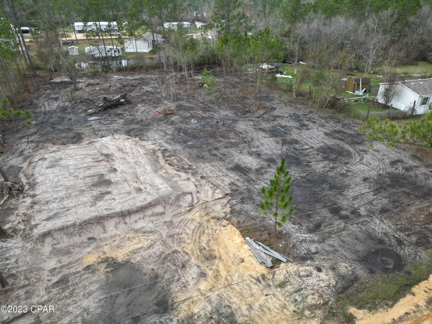 Vacant Lot Ready for your mobile home to be installed. Needs Well and Septic. Very quite area on a dead end road just min from the south port elementary. 15 min or less to the Parks of Lynn Haven also a boat ramp landing is just around the corner. Come see it today. Call your realtor and go see the land is already cleared and has a dirt pad in place already.