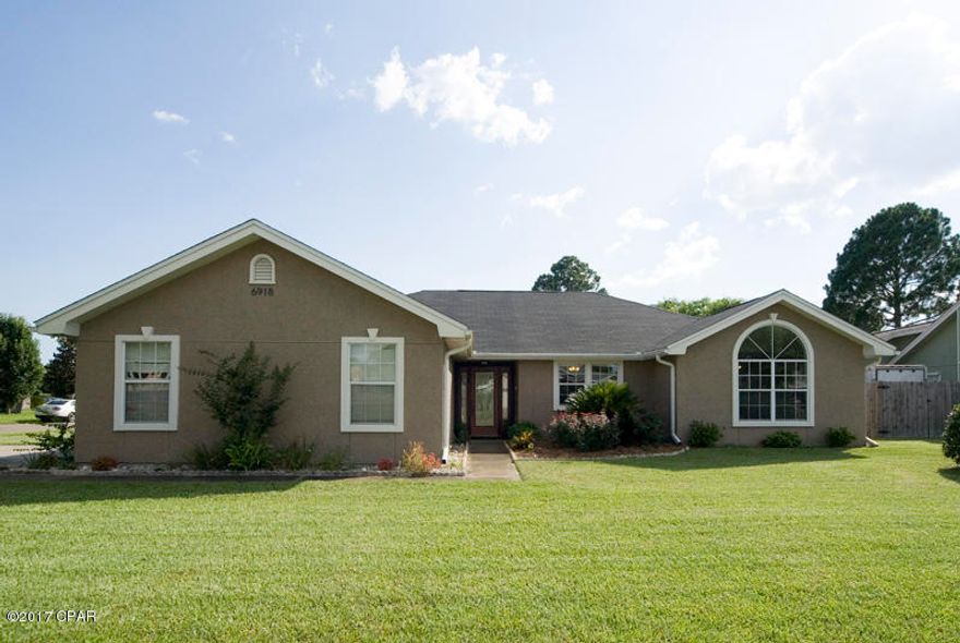 This move-in ready home on a large corner lot in Callaway Point was completely remodeled in 2008 with a new HVAC system in 2013 and a new roof coming mid Oct.  Home is perfect for military members being only 4 miles from Tyndall Air Force Base. Its open floor plan includes a living room with high ceiling accented by two recessed display niches, hardwood floors and a fireplace, as well as a spacious kitchen appointed with new cabinets, granite counters, tile floors, stainless steel appliances and breakfast bar that overlooks the light-filled dining room which, like the living room, features hardwood floors. Natural light floods into the dining room through the skylight as well as through its many windows that overlook the back patio and a large back yard with high privacy fence that features an opening large enough fo boat. The master suite is located opposite the guest bedrooms for privacy and it features hardwood floors and a sitting area that would also serve as an ideal home office or temporary nursery space. Those features are joined by a walk-in closet and bath with designer tile accents, spacious granite vanity and skylight. Hardwood floors carry throughout the two brightly-lit guest bedrooms, one of which features a floor-to-ceiling window. The Jetted tub in the tiled guest bath provides a relaxing escape, set below yet another skylight. Callaway Point is nestled between Emmons Bayou, East Bay and Callaway Bayou for easy access to the water.