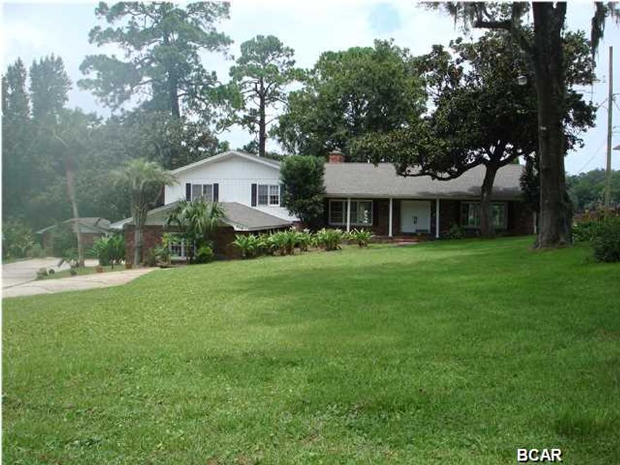 This is a Well-built, spacious home with deep water access to St. Andrew Bay, the Gulf of Mexico and intercoastal Waterway. This over-sized lot is well-landscaped, offers a boat dock and seawall on Watson Bayou, well-protected yet convenient to open Bay. The unique split-level floor plan offers a 35'x 17' family room with fireplace, 19'x 18' living room, separate bar/game room, cedar storage, many unique features. The home was vacated in June 2013 and is east to show.