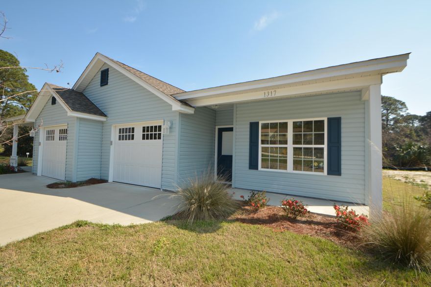 One of Bay County's premier builders is offering this new construction duplex with each unit offering 3 bedrooms and 2 baths, single-car garage with lots of attic storage, low maintenance exterior and peaceful view of Lake Caroline. The kitchen, foyer, baths and laundry feature wood-look ceramic tile. The kitchen is open to the spacious great room and features all wood raised panel cabinets and stainless appliances. The plan is a split bedroom and the master bath has a walk-in closet, spacious shower and raised double vanities. The location is just blocks from the new library, St. Andrew Bay, Lisenby walking park, the garden club walking park and dog park. Come see this quality construction in this quiet and convenient location. Call your Realtor today for your private tour.