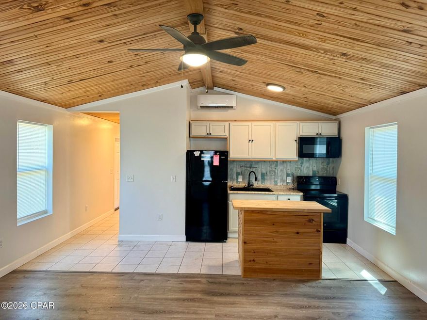 Check out this super cute home snuggled between Panama City and Lynn Haven.  This location is a quick walk to North Bay Haven Charter School, just around the corner from a brand new Publix shopping center and an easy drive to TAFB.  You will LOVE the large fenced yard for your family dog (pets are negotiable on this listing).  This home has some beautiful unique features such as custom wood plank ceilings, barn doors and great open living spaces.  If you're looking for a 2 bedroom home with LOTS of space inside and outside at a great price - this is the one you want to call about TODAY.  Just text a photo of your ID to our office phone, and we will set up your showing within the next business day!