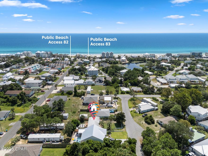 Step into a beautifully renovated coastal retreat just 3 minutes from public beach access and moments from the best dining, entertainment, and Pier Park. This bright, spacious home features elevated ceilings, wood beam accents, and new LVP flooring throughout. Enjoy a brand-new front deck, updated bathroom vanities, and two sliding glass doors that open to an entertainer's dream backyard—complete with an 8-ft privacy fence, large back deck, fire pit, and outdoor shower. Inside, three generous bedrooms offer oversized windows and abundant natural light. Outside, a convenient storage shed provides extra space for tools and gear. Fully updated and perfectly positioned for beach living or short-term rental income, this home delivers comfort, style, and unbeatable convenience. Move-in ready.