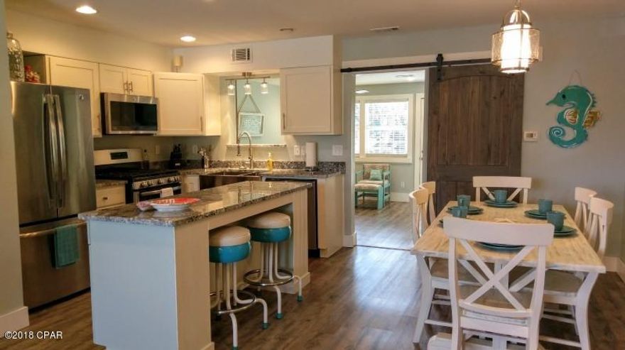 WoW... this is it!!! A Gorgeous Completely Remodeled 3 Bedroom with 3 Baths close to the Beach Walk and backs up to the Lake. If you are L@@King for that ''Coastal Looking Unit'', this unit is for YOU! You can have a Bedroom & Full Bath Downstairs. There was NO Expense Spared on this unit. NEW NEW NEW from top to bottom. It is even an ''End Unit''.

The HOA Dues are only $450 a Quarter NOT a Month and that pays for your  Basic Cable Package, Termite Bond, Household Trash, some Pest Control, Mowing your Lawn, and Lots of Amenities. There are 11 Pools ''5 Heated'', Shuffleboard Courts, Tennis Courts ''2 Lighted'', an 18 hole Mini Golf Course, Conference Center, Fitness Room PLUS there is a Private Clubhouse with a Snackbar and a Pool directly on the Beach that is Gated! Age, SF, and Dimen. a