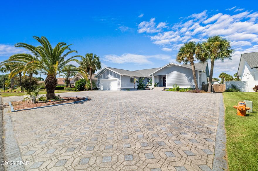 Under contract. Seller is accepting bsck up offers.Welcome to your waterfront retreat in the highly sought-after, gated Bay Point community! Perfectly positioned on a deep-water canal with 80 feet of frontage and just 5 minutes to the Gulf of Mexico, this home is a true boater's paradise, complete with a private boat lift. Enter inside through the custom African mahogany doors and be greeted by a spacious, open floor plan with vaulted ceilings, designed for both comfort and entertaining. The designer kitchen is a showstopper, featuring a massive 10-foot quartz island, custom soft-close cabinetry, (no lack of storage here!) and modern updates that will impress any chef!  The living area is bright and inviting, with French doors opening to a screened porch overlooking the canal. The split floor plan offers privacy, with a luxurious primary suite that includes a sitting area, ensuite bath, and direct pool access. Outside, enjoy the largest pool in Bay Point, perfect for gatherings or relaxing after a day on the water. Additional highlights include a cozy fireplace, a two-car garage plus extra golf cart parking, a new roof, and oversized parking that can accommodate 12-20 cars, ideal for entertaining. Living in Bay Point means enjoying a lifestyle like no other, with access to a full-service marina, championship golf, tennis courts, spa, dining, and 24-hour security. Plus, you're just a short drive from the world's most beautiful beaches in Panama City Beach. This property combines luxury, functionality, and location, making it a rare find for waterfront living.