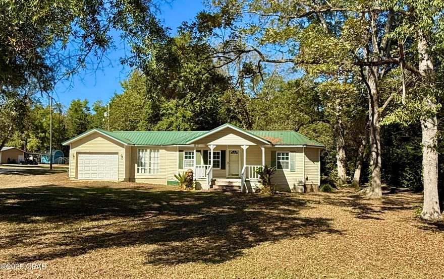 Looking for a starter home in a quiet, lazy, Florida Panhandle town?  This 2 bedroom 1 bath 1940s homestead was recently freshened up with paint, flooring, and kitchen appliances.  With just under 1000 square foot heated and cooled and situated on just over half an acre, routine maintenance will be a breeze.  The one car garage with opener adds modern convenience and the mature oak and pecan trees give you a nice view from the spacious back porch.  Schedule a tour today and let's get your plans for a future started!
