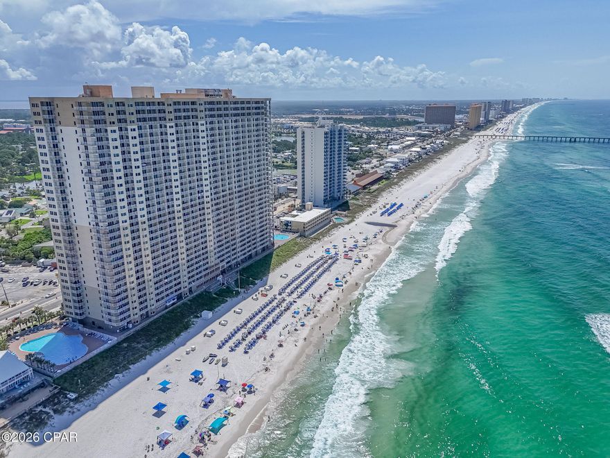 Wake up every morning to the sight of the Gulf of Mexico stretching endlessly before you -- this is the life waiting for you at Tidewater Beach Resort, Unit 2204. Perched on the 22nd floor of Panama City Beach's most amenity-rich resort, this stunning 934 sq. ft. condo is more than a home; it's a front-row seat to one of the most beautiful coastlines in the world. From the moment you walk in, the floor-to-ceiling windows command your attention, pulling your gaze straight out to the sparkling turquoise water beyond. The open-concept living space is bathed in natural light and flows effortlessly onto your private balcony -- the perfect spot to sip your morning coffee as the sun rises over the Gulf. The kitchen is equally impressive, boasting sleek granite countertops and stainless steel appliances, making everything from a quick snack to a full dinner feel effortless. With a brand new AC system installed in 2024, comfort is guaranteed year-round. The thoughtfully designed floor plan sleeps the whole crew in style. The spacious primary bedroom offers a true retreat after a long day in the sun, while the fun bunk area is perfect for the kids -- or keeping extra guests comfortable. Two full bathrooms mean no waiting in line on busy beach mornings, making this layout as practical as it is charming. Whether it's a romantic couples getaway or a full family vacation, this unit was built for it. Step outside your door and the resort experience truly begins. Tidewater Beach Resort proudly offers more amenities than any other property on the beach -- and it shows. Cool off in the stunning lagoon pools or the indoor heated pool, unwind in the Roman Spa, hit the 4,300 sq. ft. fitness center, or catch a movie in the on-site media theater. Grab your Starbucks from Flip Flops Convenience Store in the morning and wind down with dinner at Waves Restaurant in the evening, all without ever leaving the building. And just beyond the lobby doors? The sugar-white sands and emerald waters of what many call the most beautiful beach in the world. With Pier Park, acclaimed dining, and vibrant shopping just minutes away, you'll never run out of ways to enjoy the coastal lifestyle. Whether you're searching for a dream vacation home or a savvy investment property, Unit 2204 checks every box. Don't wait -- schedule your showing today and make the Gulf your backyard.