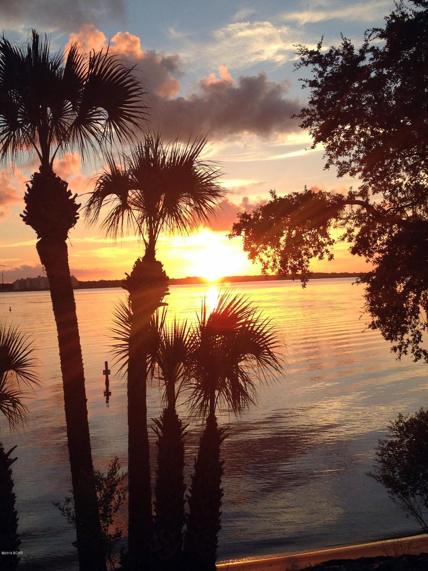 Luxury waterfront living in this boating and fishing friendly complex.  The 2 bedroom 2 bath 1st level condo offers upscale appliances with a Viking Stove, Subzero Refrigerator, and Bosch dishwasher.  The unit has all the extras with trey ceilings, granite counter tops and vanities, hardwood and tile floors in the living areas while overlooking your waterfront view from your Master Suite and the living area.  This is a secluded, NON RENTAL gated Bay Front Condo offers a large dock with boat slips that are owned individually.   The pool and owners clubhouse is also available for your social gatherings.