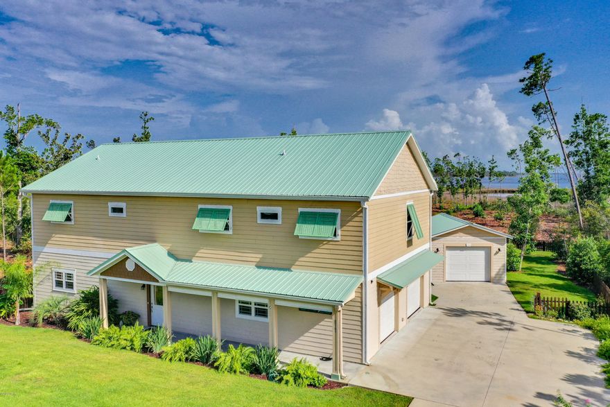 CURRENTLY UNDER CONTRACT, SELLER ACCEPTING BACKUP OFFERS Attention Boaters and Nature Lovers... This is a unique waterfront custom-built home on 1.07(+-)acres with 100 ft. on the water in the prestigious gated community of Laird Bayou. This great community has it all and the HOA fees are extremely low. It's gated, has a community pool, boat, trailer, and RV parking, and a private boat launch that will accommodate large boats so that you can easily get your boat in and out of the water without waiting in line at the public marinas. Launch your boat, canoe, or kayak from the community boat ramp right into the waters of East Bay with an abundance of trout and redfish. Or just add a boat dock right in your back yard. Boat up the Intracoastal or on out to Shell Island and through the pass into the Gulf of Mexico. Just a short drive to shopping areas, approximately 15-minute drive to Tyndall AFB and about 15 minutes to Eastern Ship Building; Desire a peaceful white-sand beach to relax on... Drive on ten more minutes to Mexico Beach.  This home was built with low-maintenance in mind! This is a SIP *(Structural Insulated Panel ) house making it one of the strongest built homes in Bay County...CAT 5 STRONG with R24 walls and R40 ceiling. The main living area is on the 2nd floor, which gives you fantastic views of East Bay from all the main rooms and bedrooms. The interior offers an Open floor plan and vaulted ceilings. The kitchen boasts custom-made maple cabinets, center island which can seat 4 to 6 people comfortably, granite counter tops, stainless steel appliances, and a large pantry. The master bedroom has a vaulted ceiling, water view, decorative shelf, en-suite bathroom w/large tiled walk in shower, granite counter tops, walk-in closet and beautiful double sinks. Guest bedroom has vaulted ceiling, water view, and a decorative shelf. The roomy guest bathroom includes a tiled walk in shower. The large laundry room offers an abundance of storage, with a 10 ft. counter, and a deep sink. The on-demand propane gas TANKLESS hot water heater offers continual hot water. The French doors off the living room opens onto a 10X30 screened back porch offering a fantastic birds-eye view of the water and a wonderful place to enjoy your morning coffee. Enjoy bald eagles, osprey, cardinals, red-wings, woodpeckers, and the list goes on. Landscaped front and fenced back yard. Garden area with five raised beds, fence-trellis for grapes, etc. First floor provides 1,040 sq. ft. of heated and cooled space with a 9 ft. ceiling. Currently used as a third bedroom with an area for entertaining. You can easily convert this space into a mother-in-law suite, work-out room, apartment, or whatever you dream. There is currently a half bath off this room which could easily be expanded to include a shower/tub. There is a 2 car 32 x 22 attached garage with race deck flooring, PLUS a 16 x 24 detached garage/workshop. Storage area is located right across the street for your boat, RV camper, etc. House is in Zone X, which is NOT in the flood zone. *For more information on SIP houses, please go to www.thermocore.com Call your Realtor TODAY to see this GREAT home.