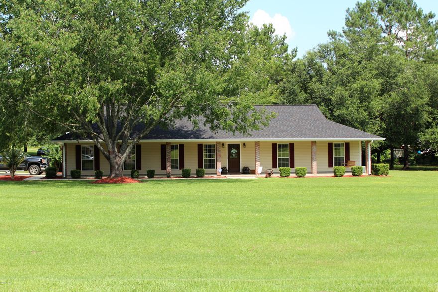 This beautiful 3 Bed/ 2 Bath home sits on .99 acre, and is located on the outskirts of beautiful Marianna, FL. Originally constructed in 1998, this home has been brought up to date while maintaining its original charm. Just minutes away Marianna High School and the MERE Sports Complex, and the new upcoming Marianna elementary school, all while secluded from highway traffic. Provides approximately 1619 SF living space (2,556 SF total under roof) and a two car garage. Your family can enjoy spending time in the spacious living area or the large open kitchen/dining area. Roof and gutters only 2 years old, and recent survey on hand.