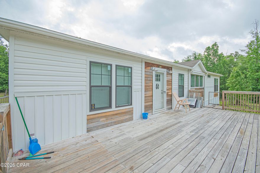 Welcome to your private slice of country living at 2504 Mildred Ln in Marianna! Nestled on 3.71 beautiful wooded acres, this 2021 Clayton-built home offers the perfect combination of modern comfort and peaceful privacy. Featuring 3 spacious bedrooms, 2 full bathrooms, and 1,830 square feet of thoughtfully designed living space, this home boasts an open-concept floor plan ideal for entertaining and everyday living. Step inside to oversized living areas filled with natural light, a spacious kitchen that flows seamlessly into the main living space, and a desirable split-bedroom layout offering privacy for the primary suite. The large primary bedroom includes a generous ensuite bath, creating a relaxing retreat at the end of the day. Built with quality construction including 2x6 exterior walls and 2x8 floor joists, this home is designed for durability and efficiency. Enjoy the outdoors from on the front and back decks, surrounded by mature trees and plenty of room to roam, garden, or simply enjoy the quiet setting. Conveniently located just minutes from I-10, shopping, dining, medical facilities, and schools, this property gives you the best of both worlds--secluded country living with easy access to town amenities. Schedule your private showing today and come experience all this property has to offer!