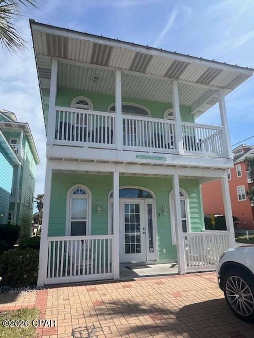 Beach cottage located across from Beach Access point! Peek-a-boo view of the Gulf, close to Pier Park, the Pier and grocery store.  Detached two story home featuring  two bedrooms each with a private full bathroom on the main level.  The primary bedroom has access to the outside and walk-in-closet.  The reverse plan with bedrooms down allows you to take advantage of the views from the living room and balcony.  There is a half bath on the living room level.  Fully equipped kitchen with updated dishwasher, stove and microwave oven.  Washer and Dryer  are included  Community pool, home has outdoor shower and parking for 4 vehicles. A/C replaced in 2025, stove and dishwasher are less than 2 years old.