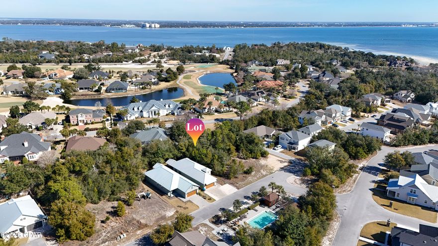 Don't miss this rare opportunity to own the lowest-priced homesite in the highly sought-after gated community of Sanctuary Beach. Perfectly positioned directly across from the community pool, this desirable lot offers the ideal setting to design and build your custom dream home in one of Panama City's most charming coastal neighborhoods.

Sanctuary Beach is known for its serene, low-maintenance lifestyle surrounded by natural beauty and mature trees, creating a peaceful retreat just minutes from everything you love about the Emerald Coast. Residents enjoy a private nature trail leading to the scenic waters of St. Andrews Bay, where you can experience breathtaking sunsets, paddleboarding, kayaking, and true coastal tranquility. Located less than half a mile from the sugar-white sand beaches and emerald waters, this prime location provides convenient access to local marinas, waterfront dining, St. Andrews State Park, and the prestigious Bay Point Golf Club. Wildlife sightings are part of daily life here, imagine sipping your morning coffee while deer wander through the neighborhood.. As an added bonus, just outside the gates you'll find a quiet public bay beach, a hidden gem perfect for relaxing, exploring nature, or enjoying the peaceful waterfront atmosphere. Whether you're looking to build a primary residence, vacation home, or coastal retreat, this exceptional homesite offers the perfect combination of location, lifestyle, and value.