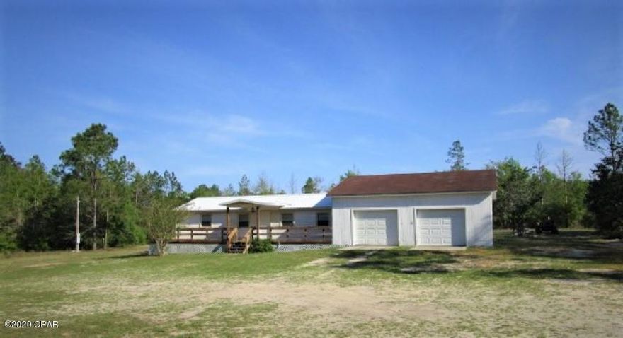 'CURRENTLY UNDER CONTRACT, SELLER ACCEPTING BACKUP OFFERS'.  Cute little county home with metal roof and lots of privacy on this 8 1/2 acre lot. This home has a large front porch and huge 29x29 foot two car garage.  This is a convenient location near school yet and off the main road so traffic should not be an issue.  Schedule your appointment to view this wonderful home today.