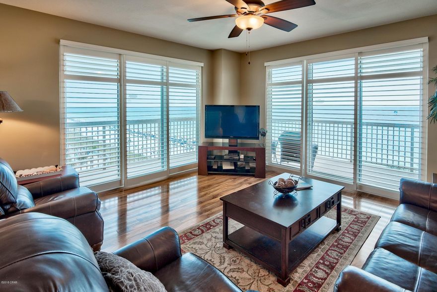 Phenomenal opportunity to own a 3-bedroom, 3-bath East end corner unit! The corner units rarely come on the market and this will not last long. Large windows & doors surround the unit bringing in great natural light  and stunning views of the Gulf of Mexico. The spacious wraparound balcony is accessed from the living area or master bedroom and is the perfect place to relax, entertain or enjoy outdoor dining. Enjoy views of the Gulf of Mexico, shimmering white sand beaches and the expansive pool area. Exquisite details and features abound in this breathtaking unit. Interior details include an open floor plan, custom plantation shutters throughout, beautiful wood floors and stylish decor. This luxury unit is being sold fully furnished & decorated and is a prime turn key investment! There is a great formal dining area with views of the Gulf and an open kitchen with granite countertops, tile floors, and ample cabinets. The granite breakfast bar is perfect for casual dining. The Gulf front master bedroom is separate from the other two bedrooms for added privacy. The room is very spacious with direct baloney access, custom plantation shutters, walk-in closet and en-sutie bathroom. Enjoy your morning cup of coffee on the balcony while taking in the views. The en-suite bathroom offers tile floors, double vanity, soaking tub to unwind in and a separate walk-in shower. There are two guest bedrooms - one with Gulf views and an en-suite bathroom and the additional guest bedroom has a separate bath nearby. There is a laundry room with a full size washer & dryer and storage. This unit is currently a non-rental and well maintained, however, this could easily be an income producing rental unit - projected at nearly $49,000! 

Sunrise Beach has luxurious amenities including: 2 elevated Gulf front pools, one heated seasonally, 2 spas, large sun deck, spray park, owners lounge with full kitchen, Gulf front exercise room, theatre, plenty of underground parking, Gulf front gas grills, 330 ft. of beautiful white sandy beachfront. An onsite seasonal beach service that rents beach chairs & umbrellas and a variety of watersports including jet skis, catamarans, paddle boards, banana boat rides and parasailing! Sunrise Beach is a deluxe 25-story Gulf front complex with 275 units. It is located just east of Pier Park (apx. 1 mile) and only a short drive to Frank Brown Recreation Center and Gulf World marine park. Paradise awaits!