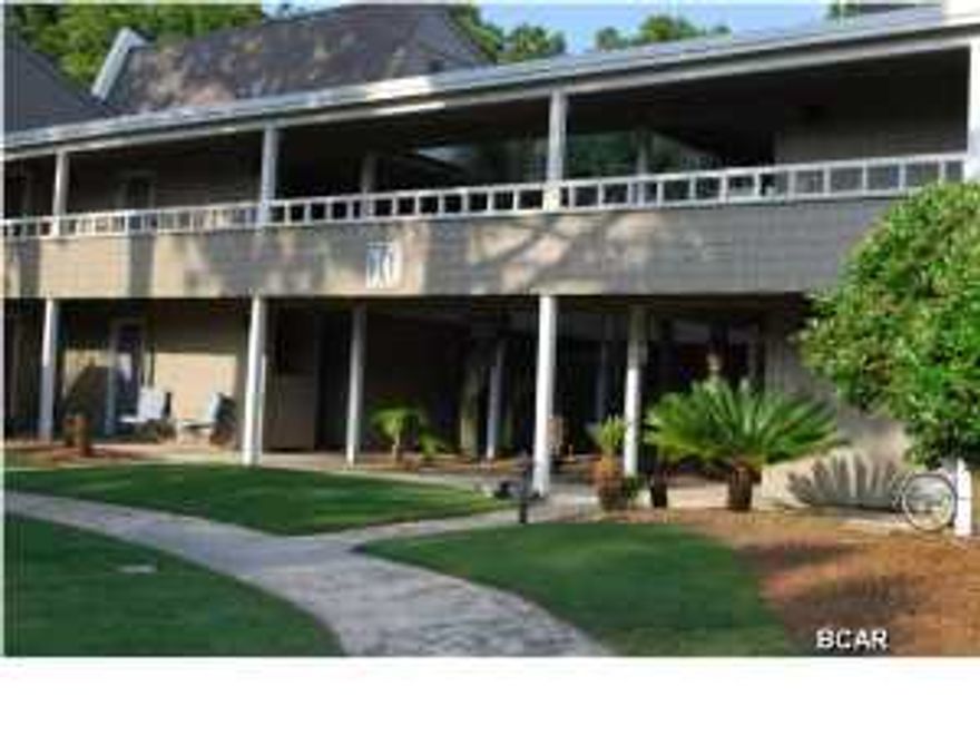 The best of both worlds, lush manicured golf course views and top notch marina on Grand Lagoon just steps away. This second floor efficiency condominium offers ample light with large windows overlooking the course, breakfast bar, separate sleeping area with large dressing section. For an efficiency this has great space. Close to the security gate, the location gives you quick access to public roads. Be a part of this waterfront community today!