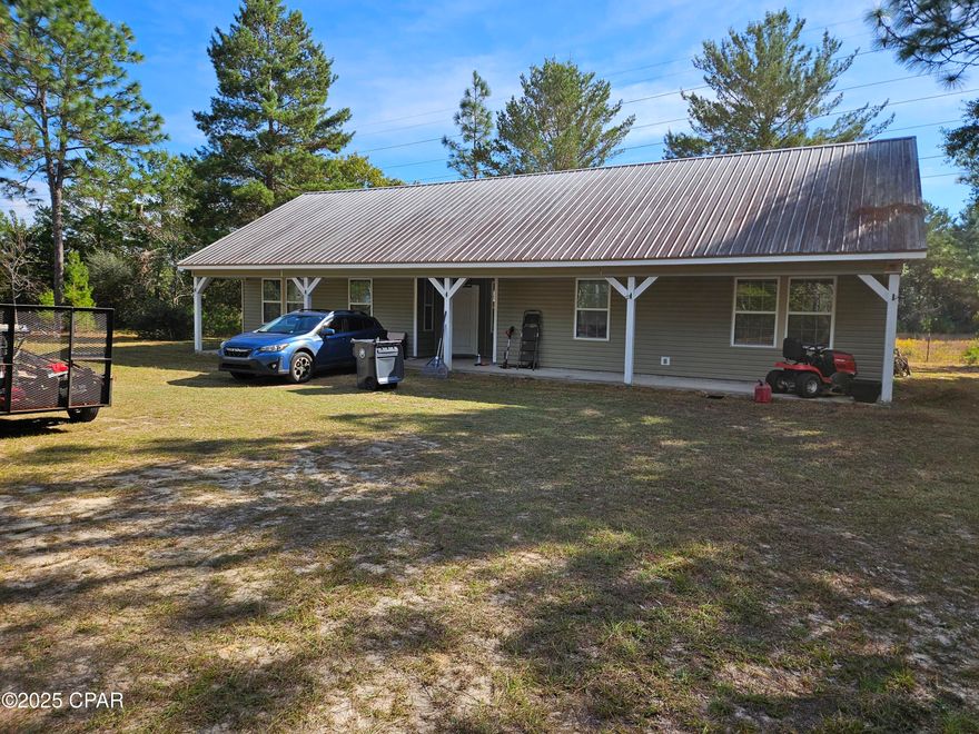 Private 14.28-Acre Retreat with Spacious Home & Workshop

Welcome to your own private haven! Nestled on 14.28 peaceful acres surrounded by mature pine trees, this beautifully maintained property offers the perfect blend of comfort, space, and rural charm.

The 3-bedroom, 2-bath home features an inviting open layout with a large galley kitchen designed for the home chefâ”complete with stainless steel appliances, a center island, and ample cabinetry for all your storage needs. A dedicated laundry room adds everyday convenience.

Step outside and enjoy the privacy of the partially fenced acreage, ideal for pets, gardening, or hobby farming. The outbuilding offers versatile potentialâ”use it as a workshop, man cave, or even transform it into a guest house for visiting family and friends.

Whether you're looking for space to roam, a peaceful retreat from the city, or room to pursue your hobbies, this property delivers it all.

Don't miss this rare opportunity to own a beautiful home with acreage and endless possibilities! 

Open floor plan: A common modern feature, open layout combine the kitchen, dining room and living areas to create spacious and welcoming environment.

Recreational use:  A portion of the land could be usefor recreation, such as trails for walking, atv, and hunting.

Livestock:  The acreage is large enough to support various livestock, such as goats, pigs,  or horses with room for a barn or other structure.