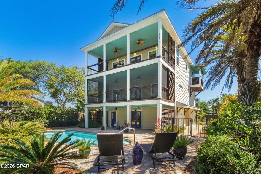 Check out this rare opportunity to own a hilltop custom home with exceptional Gulf views on Florida's Forgotten Coast.  This custom-built home has never been used as a rental and has had just one owner who meticulously maintained it. It has the charm and details perfect for a personal residence, but also massive rental possibilities for investors. 


This three-story coastal home sits on an expansive .573-acre parcel in St. Joe Beach just east of Mexico Beach and directly across from the Gulf.  This property offers unbelievably large front and backyard spaces for a home that is so close to the Gulf.  The backyard alone is approximately 100 feet by 60 feet, which is larger than many nearby lots.  As a result, this home has nearly endless exterior parking opportunities whether it be for your boat, RV, or extra spaces for renters.  All of this space also provides the flexibility to add additional square footage, especially when you consider that this property is not in a flood zone.


The outdoor living space is where this home truly shines. The inground pool is framed by an elegant brick paver deck, creating a polished, resort-like setting. Surrounded by mature, thoughtfully designed landscaping, the pool feels tucked away and serene--something increasingly hard to find at the beach. The private outdoor shower adds a distinctly tropical touch, while the nearby tiled bathroom offers convenience for pool guests.


From the ground level, access all floors by elevator or by an upscale traditional staircase - no need to struggle with exterior stairs or a narrow staircase common in many beach houses.  Also, the elevator offers handicap accessibility that is rare in multi-story coastal homes. The third floor is the heart of the home--an open-concept living, kitchen, and dining area designed to capture elevated views of the Gulf. A gas log fireplace anchors the living space, while the 30x12 foot front porch invites you to relax and take in the coastal breeze. Two additional bedrooms share a full bath, and one features its own private balcony overlooking the water. An oversized walk-in pantry that could also be used as a lock-out closet completes the thoughtfully designed upper level.


The second floor is designed with comfort and flexibility in mind. The spacious master suite and bonus area occupy the entire front of the home -- featuring dual vanities, a large tiled shower, and a walk-in closet with a custom shelf system. The master suite's generous 14.5 x 11 foot bonus room is perfect for an office, gym, nursery, additional sleeping space, or just a luxuriously large seating area. Both the bedroom and bonus room open to a full-length screened porch with gas and water hookups, creating a peaceful, year-round retreat with Gulf views. A private guest suite with en suite bath sits toward the rear of the home.  Between these two suites sits a custom, built-in laundry area with surrounding cabinetry and workspace, which blends in seamlessly and allows you the option to conceal the washer and dryer. 


The center of the ground level features a formal foyer and seating area leading to the elevator and staircase. On each side of the foyer is an extra large enclosed garage bay each with additional storage closet space.  The right garage bay is expanded to accommodate a golf cart or riding mower and is complete with its own automatic rear-entry garage door, while the left garage bay features direct access to the pool.  Outside just steps from the pool is a quaint pool house with a bright, cheerful interior.  It includes electricity, a ceiling fan, refrigerator, counterspace and a large sink. Whether used as a poolside lounge, creative workspace, or additional storage, it enhances the entire outdoor experience. Altogether, this setup creates an ideal environment for hosting--seamlessly accommodating long beach days, pool gatherings, and effortless indoor-outdoor living. Situated next to Veterans Memorial Park at Beacon Hill, you will enjoy a large beach access, four pickleball courts, a dog park, playground, and more.  Unique Forgotten Coast experiences like scalloping and fishing in St. Joe Bay and evenings in historic downtown Port St. Joe, resort-style downtown Windmark Beach, or charming Mexico Beach are just minutes away.


Never rented and lovingly cared for, this home offers exceptional income-producing potential with no HOA fees or restrictions and low unincorporated property taxes.  With space, charming details, accessibility, and a resort-style outdoor setting just steps from the Gulf, this is a property that truly stands apart.