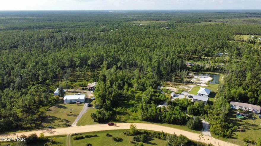 BUILD YOUR DREAM HOME ON THIS 2.19 ACRE LOT WITH A POND. 
This expansive 2.19 acre lot offers the perfect opportunity to create your dream home in a serene and private setting. The property features a pond adding a touch of natural beauty and tranquility to your home site.
Previously, the land hosted a mobile home and included a well and septic system, though the condition of these systems is not guaranteed. Buyers are encouraged to conduct their own inspections to verify functionality. 
Enjoy the best of both worlds with this property-peaceful seclusion and convenience! Located close to Tyndall Air Force Base, this land is also just minutes from shopping, boat ramps, parks and other amenities.
Don't miss this chance to build your dream home in an ideal location with plenty of space to spread out and enjoy the natural surroundings.