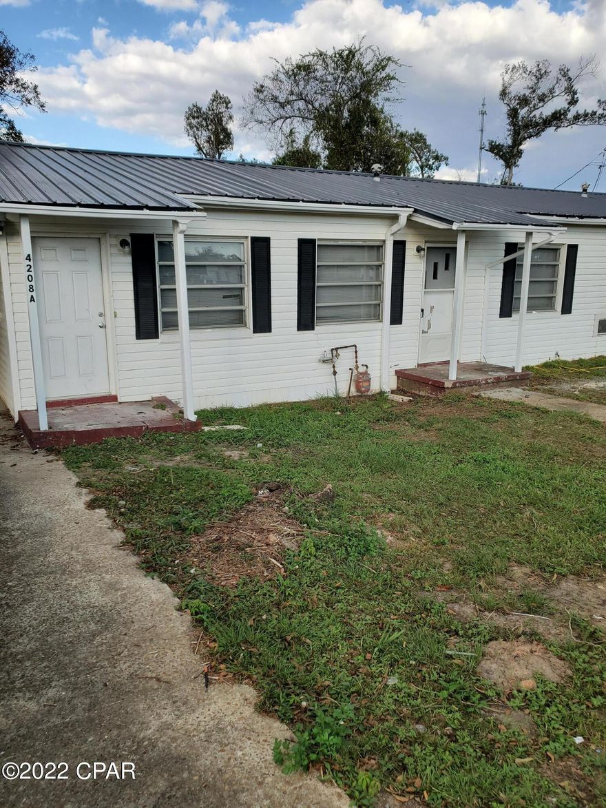 Back on the market with no fault to the seller. Investor Special!! This duplex has a new roof and has 1BR and 1 BA in each unit. It has a large gathering area in unit A that could be converted for additional rooms. It has 2 kitchens and 2 laundry rooms as well. Outside you will find a 2-car attached carport with a utility room. There is new tile flooring installed in the large gathering room in unit A. It is in the heart of Marianna, minutes from dining and shopping. According to the City of Marianna Planning and Zoning department this property is designated as mixed use and could be used as residential or commercial. It also means that you could convert it into a single-family residential dwelling. The property is now being rented out for $1500 a month for both units. The tenant would like to stay after the sale of the property.