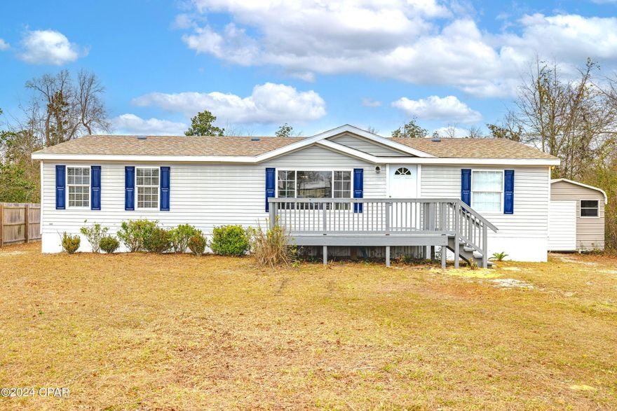 What a beauty!  Just like brand new and conveniently located on a paved road with almost  1/2 acre.  This home has 3 bedrooms, 2 baths.  It's a split floorplan with living and kitchen in the middle of the home.  Everything has been redone, and the seller has spared no expense to bring this home right into 2024 with new: Granite countertops, Stainless Appliances, Laminate Wood Floors and High padding Carpet. There's new paint inside and out, a large new front porch, new exterior front and back doors, as well as new interior doors, new  lighting, Chandelier and Modern ceiling fans.  This home is easy maintenance, built on a Steel Frame, above grade, with a brand new AC and New electrical including Power Mast, Plugs, Outlets, Receptacles and Switches.  The Pressure Tank on the Well pump was replaced, along with the Home's Skirting.  As a bonus, the Septic was pumped and CERTIFIED in Feb 2024.   You'll be hard-pressed to find a more MOVE IN READY home in this price range, in the entire 3 county area!  Call today for a tour of this great buy.  (All Info is presumed accurate.  All buyers should verify any info that is important via survey, appraisal, inspection, schools, etc. )