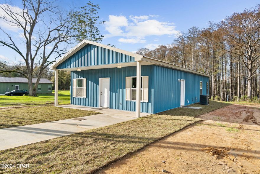 CURRENTLY UNDER CONTRACT, SELLER WILL CONSIDER BACKUP OFFERS Discover the future of sustainable living with this under-construction Energy-Efficient home. Crafted with precision using all-steel framing on both the interior and exterior, this eco-friendly masterpiece is made from 67% recycled metal. Featuring a modern design, the home showcases a sleek metal roof, metal siding, and an array of energy-efficient amenities.

The interior features solid wood custom cabinets with a soft-close feature, elevating the living experience with a touch of elegance. You'll also find a side-by-side refrigerator with a water and ice maker, central heat/air with a heat pump for year-round comfort, and an electric On Demand water heater for efficient use. The home is further adorned with top-of-the-line appliances and easy-maintenance stained concrete floors. 

Rest easy knowing that this home not only meets all current Florida building and energy codes but also qualifies for some of the lowest insurance rates in the area. Additional highlights include a 10 x 10 metal outbuilding for extra storage, a spacious front porch perfect for relaxation, and a well-designed concrete parking pad with a sidewalk and side entrance, ensuring convenient unloading of groceries directly into the kitchen.  Plus, the adjacent parcel is available for purchase, providing the opportunity to expand your yard space.

Experience the perfect blend of style, sustainability, and functionality in this thoughtfully crafted home designed for the eco-conscious homeowner.