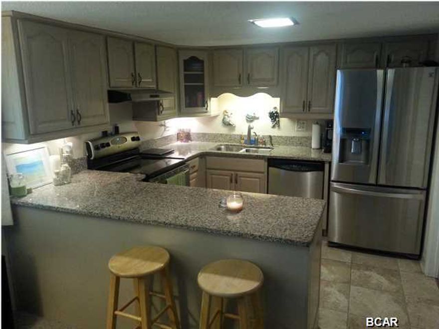 ***Price Reduced!!*** Beautiful first floor unit (not the ground floor) overlooking the Gulf of Mexico and Lake Powell on the other side that is just steps to the beach or to the lake! It has a gourmet kitchen with its modern stainless steel appliances and granite counter tops. The upstairs master bedroom has its own private balcony overlooking the Gulf of Mexico. The living area has a stunning view of Lake Powell and the boat docks at Pinnacle Port. Pinnacle Port Resort is a 25+ acre gated community that has over 1/4 mile of beach frontage! Amenities include two swimming pools, tennis courts, sauna/steam room, fitness room, its own private freshwater dock with boat slips and a boat launch. Please note that the association fees below include electricity for heating, cooling and hot