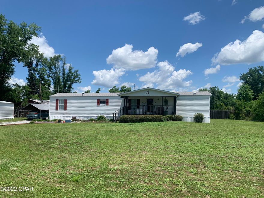 YOUNGSTOWN! This cozy, clean home features three bedrooms and two full bathrooms, a covered front porch, back deck,  a shed and a car canopy. The home sits on a large lot and is in excellent condition!  Don't miss this opportunity to  make this home your own! Dimensions are approximate. Buyer to verify if deemed important.