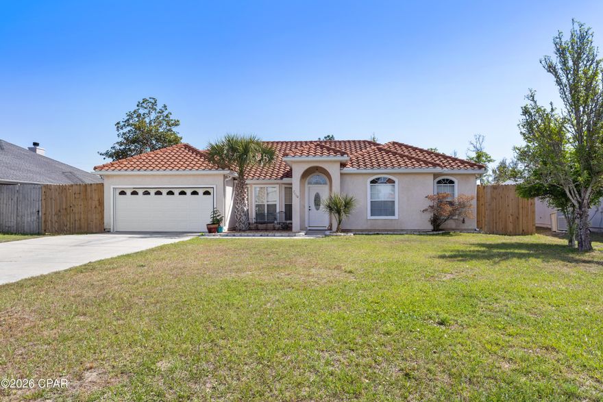 Welcome to this beautiful 4-bedroom, 2-bath home offering 1,794 sq ft of living space on a spacious .28-acre lot with no HOA. 
Remodeled in 2023, this move-in ready home features an efficient, well-designed layout that blends style with everyday functionality.
Recent improvements provide added peace of mind, including a newer clay tile roof and a high-efficiency 17 SEER HVAC system. The interior updates create an inviting space designed for both comfort and convenience.
Step outside to enjoy the fully fenced backyard featuring an 8-foot privacy fence, offering exceptional security for children and pets while creating the perfect setting for entertaining family and friends. The oversized outdoor space is ideal for gatherings, play, and relaxing at home. A double rear gate provides convenient access to the easement/drainage area with ample room for maintenance equipment, trailers, or recreational vehicles. A variety of fruit trees in both the front and backyard add charm and a touch of Florida living.
Additional value-added features include a separate irrigation water meter for cost savings and a 2-year home warranty, giving buyers added confidence and long-term peace of mind.
Nestled in a quiet, well-kept neighborhood, this home is centrally located near excellent schools, shopping, dining, and everyday conveniences. Commuters and military families will appreciate being just 10-15 minutes from Tyndall Air Force Base, approximately 25-30 minutes to the sugar-white sands of Mexico Beach, and 30-35 minutes to Panama City Beach.
All measurements are approximate and should be verified if important.